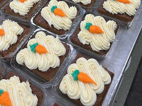 Carrot cake squares with piped frosting and tiny frosting carrots